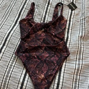 Brand new with tags Skatie one piece swim suit.